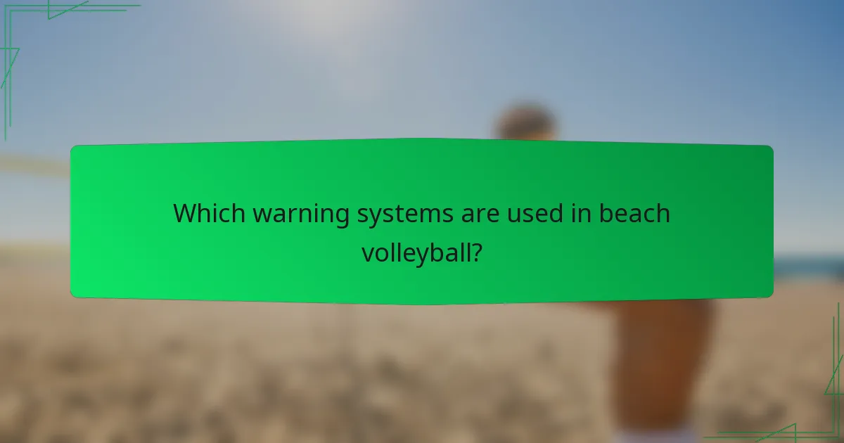 Which warning systems are used in beach volleyball?